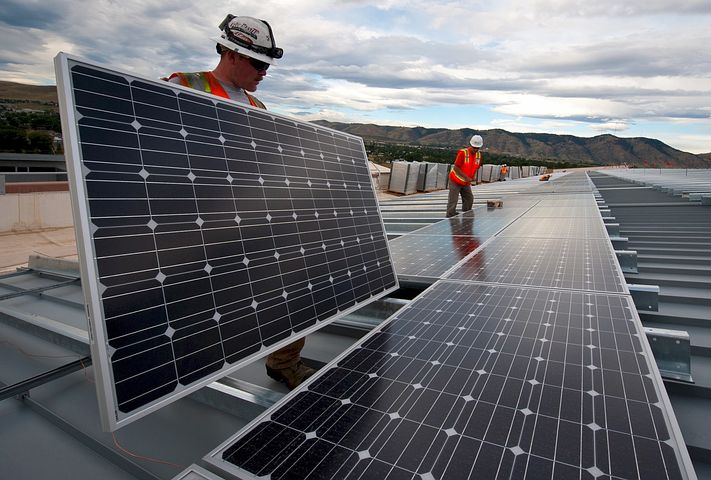 Two men providing solar panel financing solutions